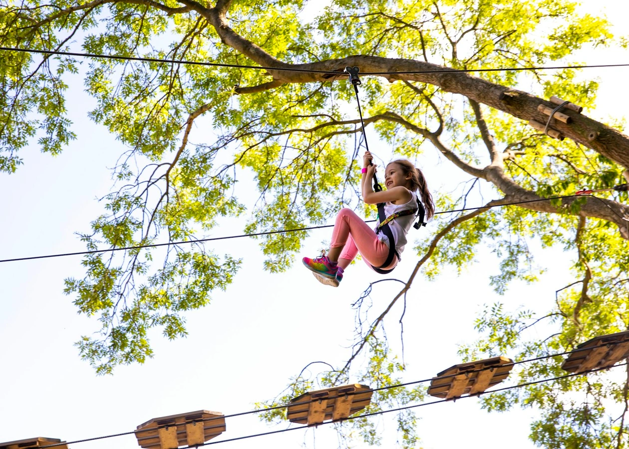 Young person on a zipline.